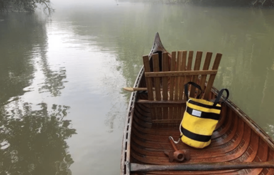 Rope bag in wooden canoe
